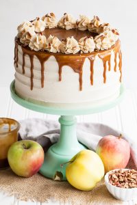 Apple Toffee Crunch Cake - fresh apple cake with crunchy pecans, cinnamon buttercream and a toffee sauce drip | by Tessa Huff for TheCakeBlog.com