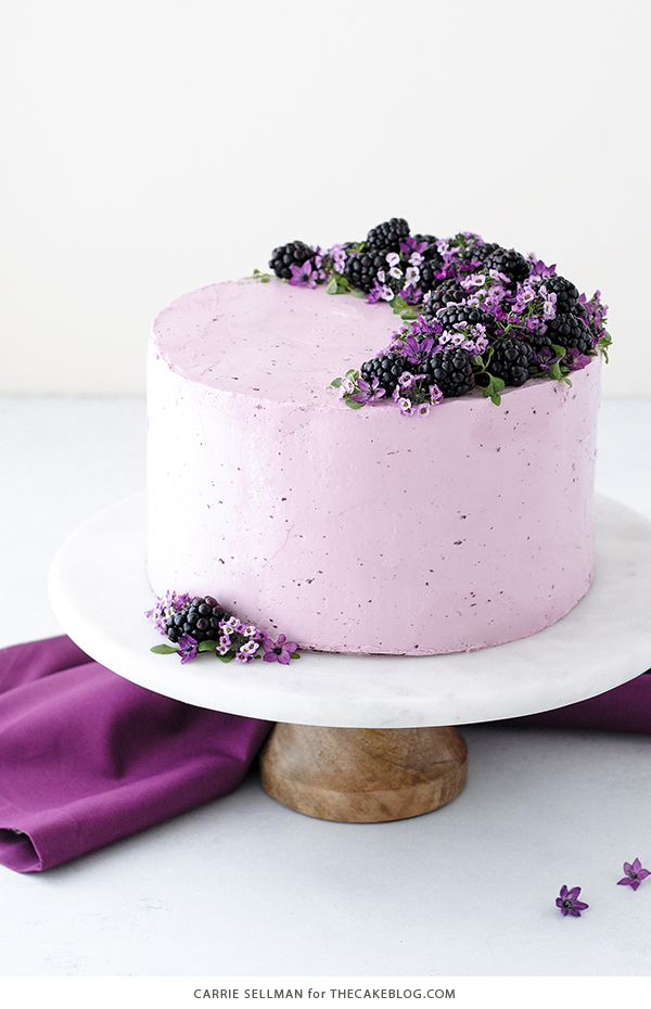 Blackberry Lime Cake - tender cake infused with lime zest, frosted with blackberry buttercream, topped with fresh blackberries and edible flowers | by Carrie Sellman for TheCakeBlog.com