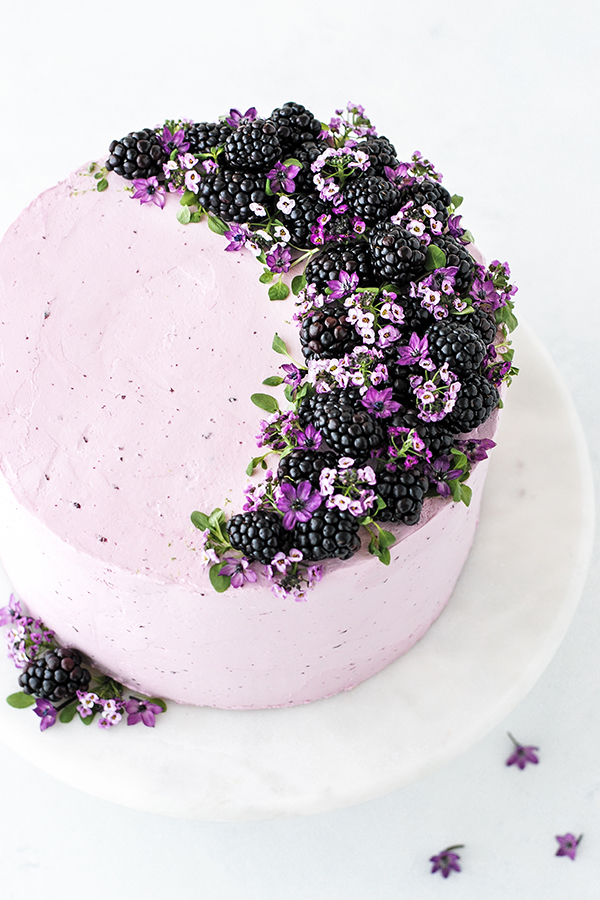 Blackberry Lime Cake - tender cake infused with lime zest, frosted with blackberry buttercream, topped with fresh blackberries and edible flowers | by Carrie Sellman for TheCakeBlog.com
