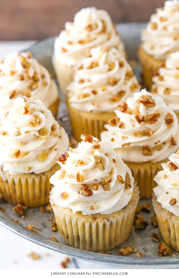 Butter Pecan Cupcakes - moist vanilla cupcakes studded with toasted butter pecans and topped with cinnamon buttercream frosting | by Lindsay Conchar for TheCakeBlog.com