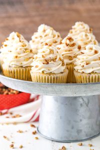 Butter Pecan Cupcakes - moist vanilla cupcakes studded with toasted butter pecans and topped with cinnamon buttercream frosting | by Lindsay Conchar for TheCakeBlog.com