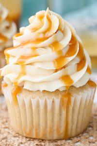 Caramel Bourbon Vanilla Cupcakes - a brown sugar bourbon cupcake topped with caramel vanilla frosting for a unique combination that is full of flavor!