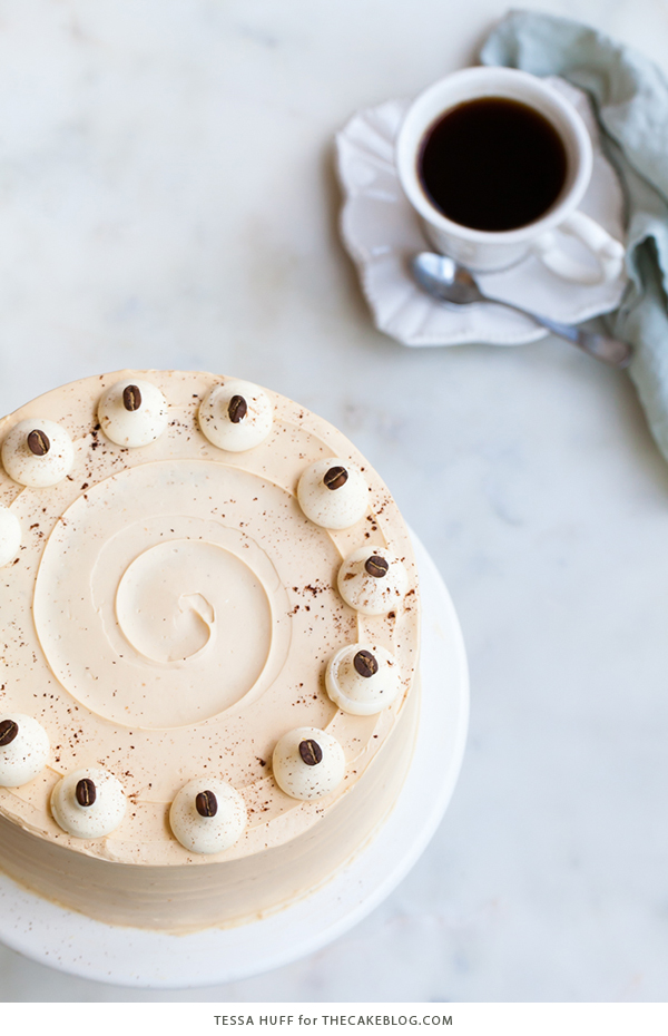 Caramel Cappuccino Cake - espresso cake paired with caramel buttercream frosting, topped with whole coffee beans and a sprinkle of cocoa powder | by Tessa Huff for TheCakeBlog.com