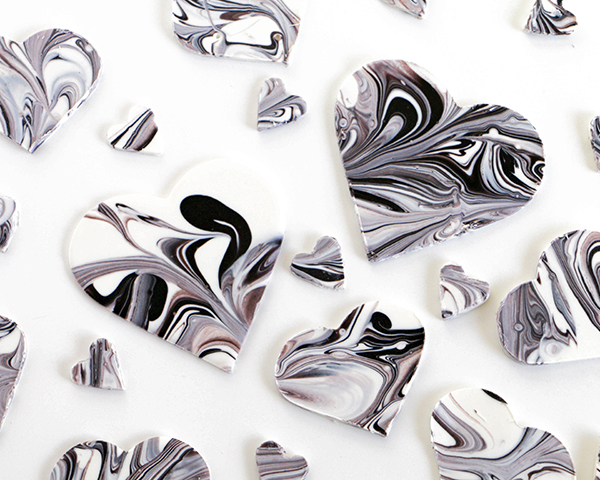 Marble Chocolate Hearts - how to make marbled heart toppers for cakes and cupcakes using chocolate coating and cookie cutters | by Erin Gardner for TheCakeBlog.com