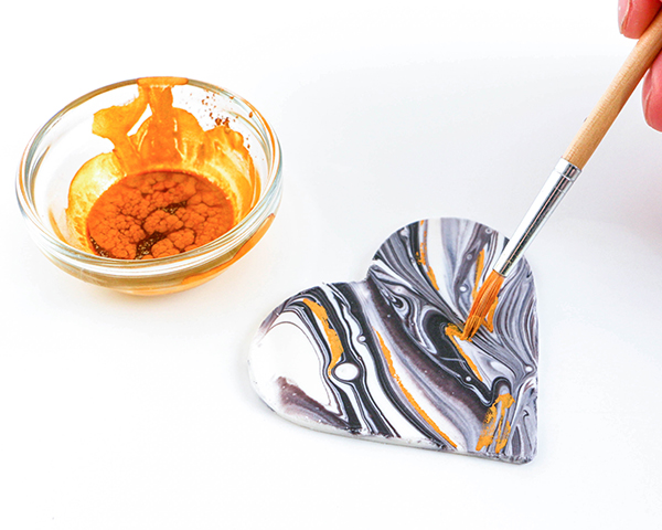 Marble Chocolate Hearts - how to make marbled heart toppers for cakes and cupcakes using chocolate coating and cookie cutters | by Erin Gardner for TheCakeBlog.com