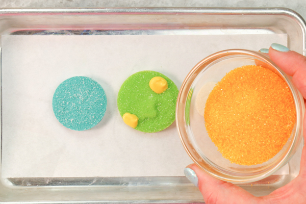 Sprinkle Ornament Cake – how to make sparkling ornaments for cakes and cupcakes using chocolate, cookie cutters and sprinkles | by Erin Gardner for TheCakeBlog.com