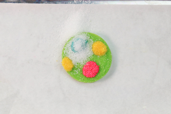 Sprinkle Ornament Cake – how to make sparkling ornaments for cakes and cupcakes using chocolate, cookie cutters and sprinkles | by Erin Gardner for TheCakeBlog.com