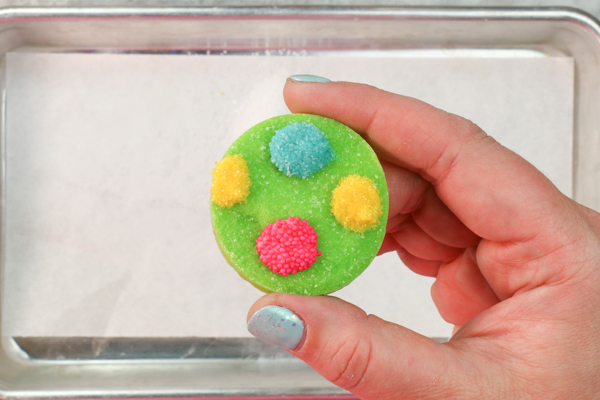 Sprinkle Ornament Cake – how to make sparkling ornaments for cakes and cupcakes using chocolate, cookie cutters and sprinkles | by Erin Gardner for TheCakeBlog.com