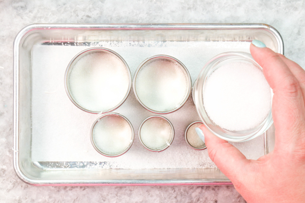 Sprinkle Ornament Cake – how to make sparkling ornaments for cakes and cupcakes using chocolate, cookie cutters and sprinkles | by Erin Gardner for TheCakeBlog.com