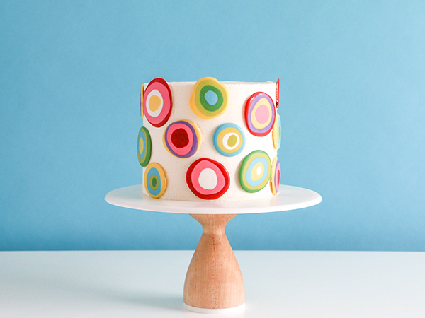 Mod Polka Dot Cake - how to make colorful polka dot toppers for cakes and cupcakes using chocolate coating | Erin Gardner for TheCakeBlog.com