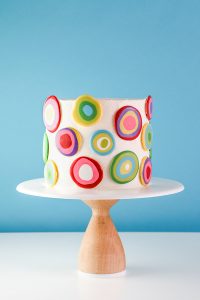 Mod Polka Dot Cake - how to make colorful polka dot toppers for cakes and cupcakes using chocolate coating | Erin Gardner for TheCakeBlog.com