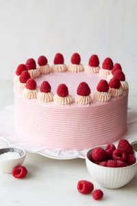 Chocolate Raspberry Cake - moist chocolate cake layered with raspberry jam, topped with raspberry cheesecake frosting and fresh red raspberries | by Tessa Huff for TheCakeBlog.com