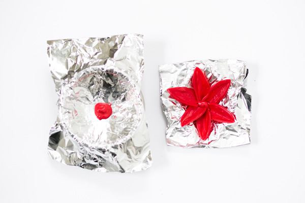 Chocolate Poinsettias - learn how to make these chocolate flowers with candy melts and a knife | Erin Gardner for TheCakeBlog.com