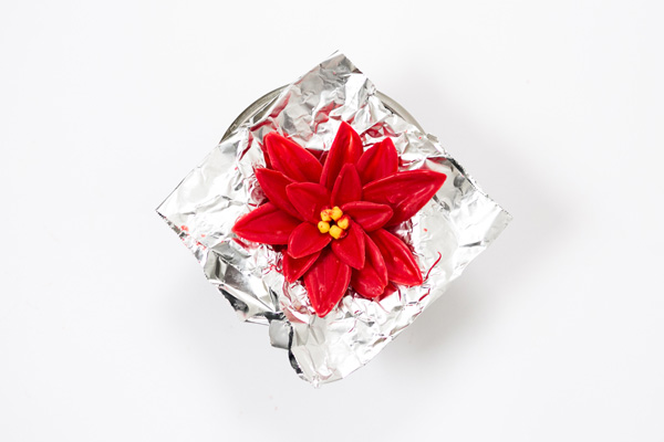 Chocolate Poinsettias - learn how to make these chocolate flowers with candy melts and a knife | Erin Gardner for TheCakeBlog.com