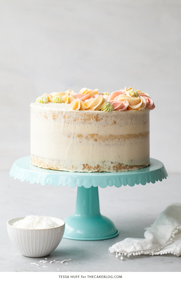 Coconut Cake - homemade coconut cake with creamy coconut milk, brushed with coconut syrup to keep it extra moist, and topped with vanilla bean buttercream frosting | by Tessa Huff for TheCakeBlog.com