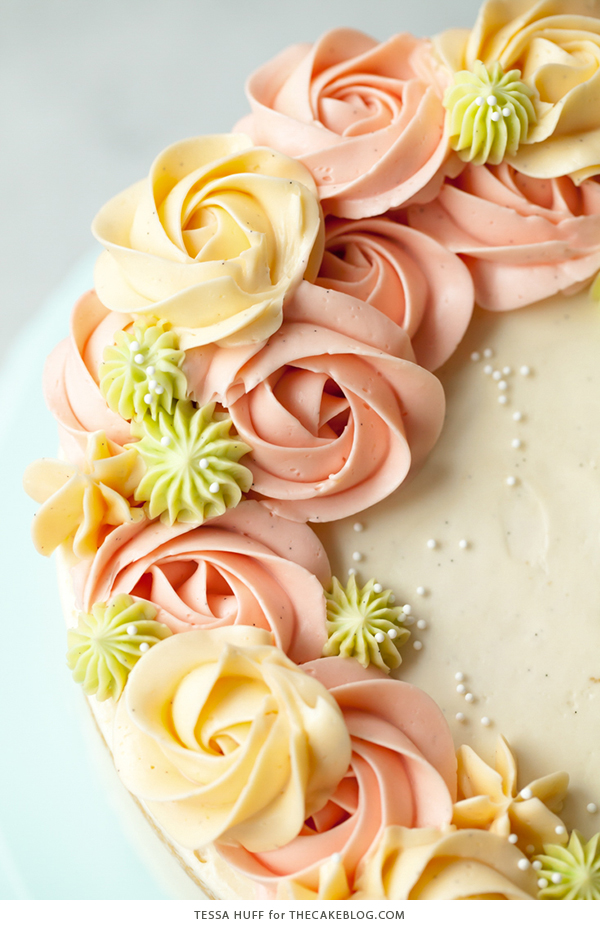 Coconut Cake - homemade coconut cake with creamy coconut milk, brushed with coconut syrup to keep it extra moist, and topped with vanilla bean buttercream frosting | by Tessa Huff for TheCakeBlog.com