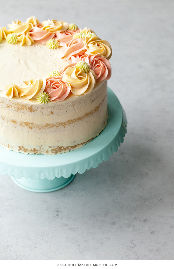 Coconut Cake - homemade coconut cake with creamy coconut milk, brushed with coconut syrup to keep it extra moist, and topped with vanilla bean buttercream frosting | by Tessa Huff for TheCakeBlog.com