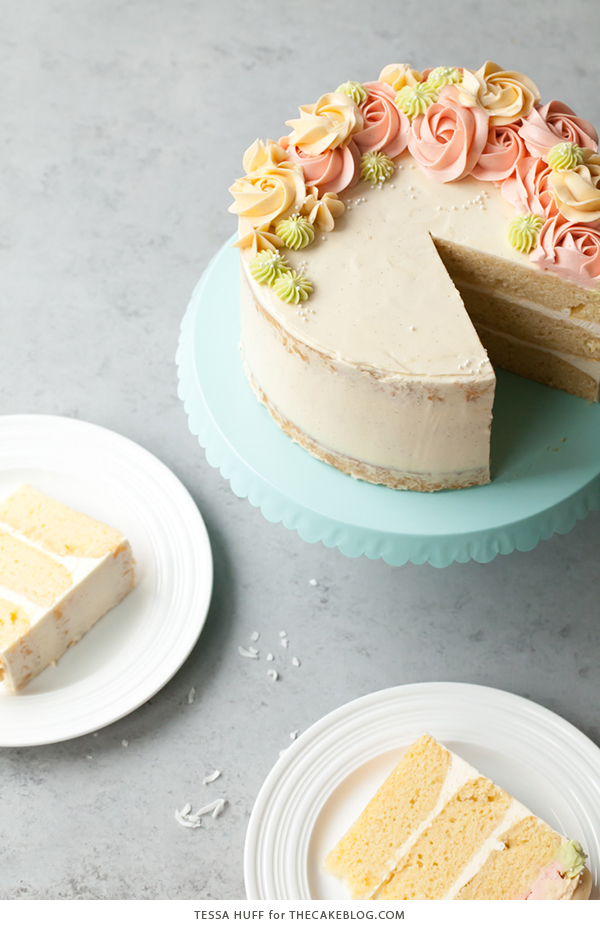 Coconut Cake - homemade coconut cake with creamy coconut milk, brushed with coconut syrup to keep it extra moist, and topped with vanilla bean buttercream frosting | by Tessa Huff for TheCakeBlog.com