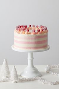 Cranberry Orange Spice Cake - citrus cake studded with tart cranberries and topped with white chocolate orange buttercream | by Tessa Huff for TheCakeBlog.com