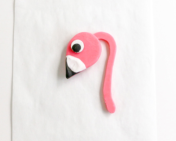 Flamingo Cake - how to make a pink flamingo cake topper using chocolate candy melts and brushstroke feathers | by Erin Gardner for TheCakeBlog.com