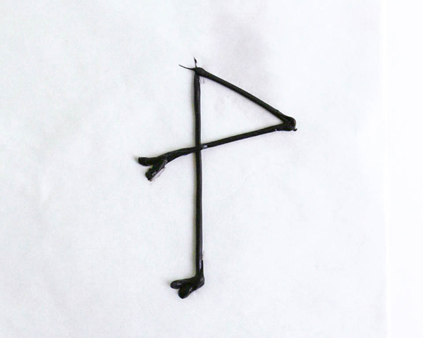 Flamingo Cake - how to make a pink flamingo cake topper using chocolate candy melts and brushstroke feathers | by Erin Gardner for TheCakeBlog.com