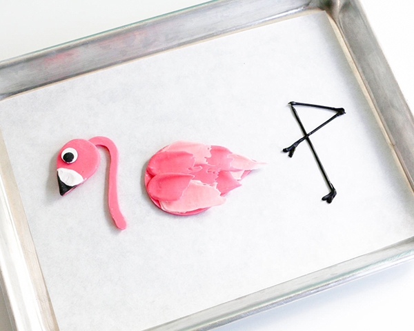 Flamingo Cake - how to make a pink flamingo cake topper using chocolate candy melts and brushstroke feathers | by Erin Gardner for TheCakeBlog.com