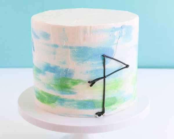 Flamingo Cake - how to make a pink flamingo cake topper using chocolate candy melts and brushstroke feathers | by Erin Gardner for TheCakeBlog.com