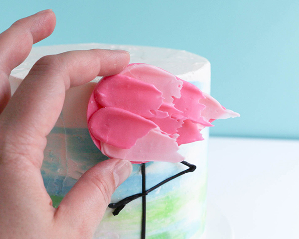 Flamingo Cake - how to make a pink flamingo cake topper using chocolate candy melts and brushstroke feathers | by Erin Gardner for TheCakeBlog.com