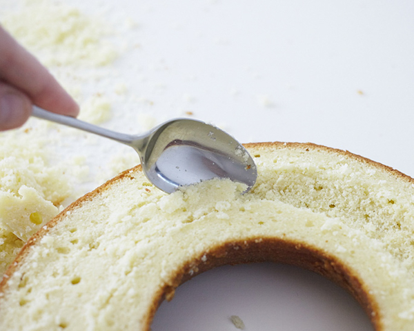 Giant Donut Cake! Learn how to make this adorable, sprinkle-coated, giant donut cake with a simple step-by-step tutorial | by Cakegirls for TheCakeBlog.com