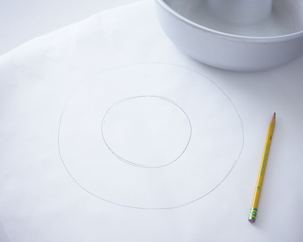 Giant Donut Cake! Learn how to make this adorable, sprinkle-coated, giant donut cake with a simple step-by-step tutorial | by Cakegirls for TheCakeBlog.com