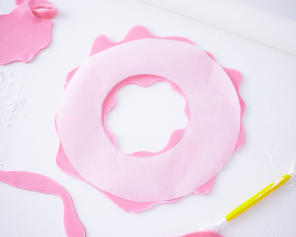 Giant Donut Cake! Learn how to make this adorable, sprinkle-coated, giant donut cake with a simple step-by-step tutorial | by Cakegirls for TheCakeBlog.com