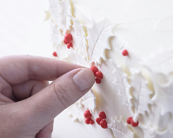 Holly Gift Box Cake! Learn how to make this festive gift box cake that looks just like a present | by Cakegirls for TheCakeBlog.com