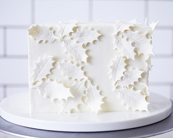 Holly Gift Box Cake! Learn how to make this festive gift box cake that looks just like a present | by Cakegirls for TheCakeBlog.com