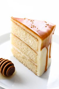 Honey Butter Cake | honey cake with honey cream cheese frosting topped with a honey butterscotch glaze | by Carrie Sellman for TheCakeBlog.com