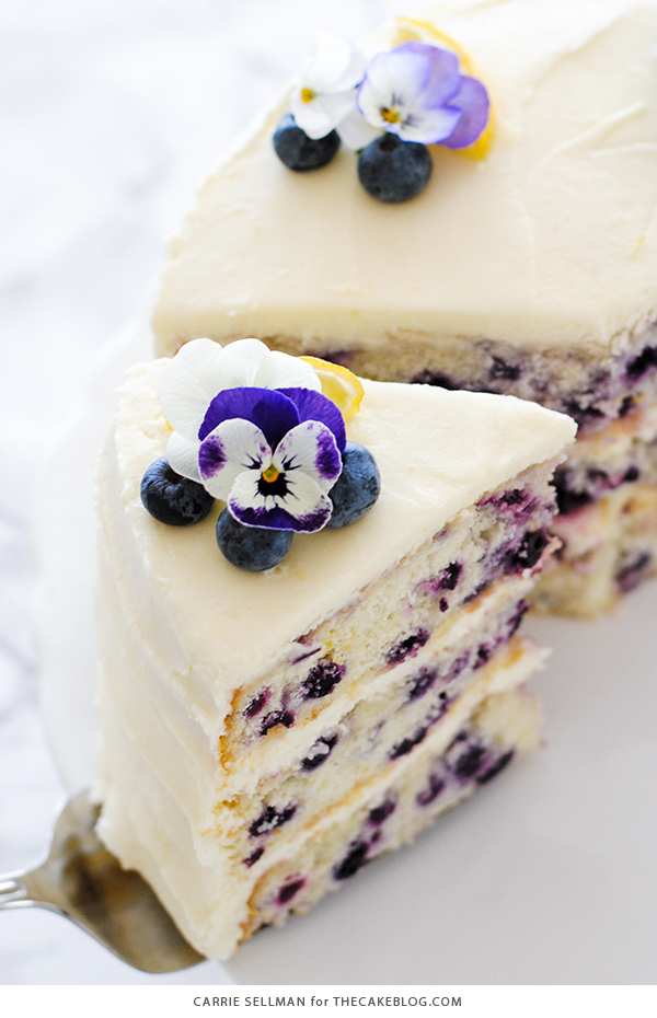 Lemon Blueberry Cake - lemon cake studded with wild blueberries, topped with lemon cream cheese frosting | by Carrie Sellman for TheCakeBlog.com