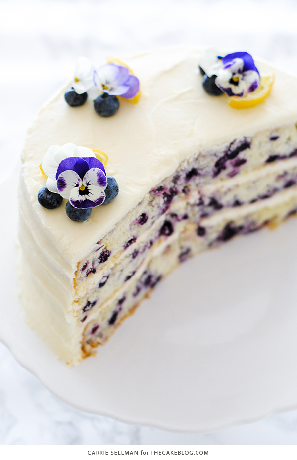 Lemon Blueberry Cake - lemon cake studded with wild blueberries, topped with lemon cream cheese frosting | by Carrie Sellman for TheCakeBlog.com