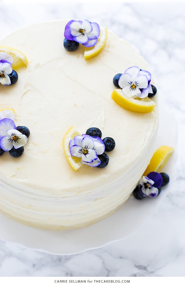Lemon Blueberry Cake - lemon cake studded with wild blueberries, topped with lemon cream cheese frosting | by Carrie Sellman for TheCakeBlog.com