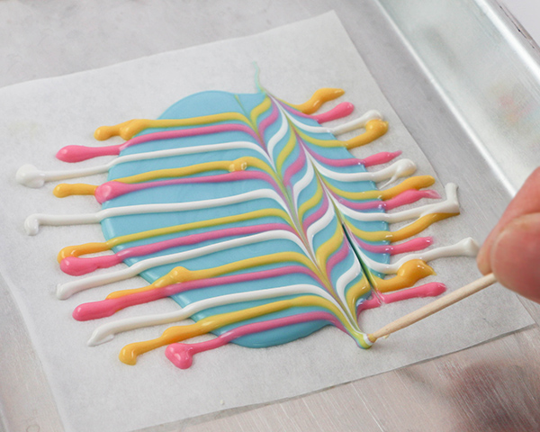 Marbled Chocolate Easter Eggs - how to make marbled Easter egg toppers for cakes and cupcakes using chocolate coating and cookie cutters | by Erin Gardner for TheCakeBlog.com