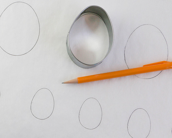 Marbled Chocolate Easter Eggs - how to make marbled Easter egg toppers for cakes and cupcakes using chocolate coating and cookie cutters | by Erin Gardner for TheCakeBlog.com