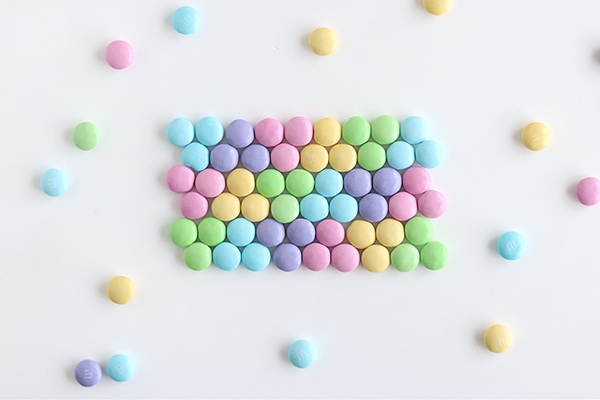 Pastel Rainbow M&M Cake | by Whitney DePaoli for TheCakeBlog.com