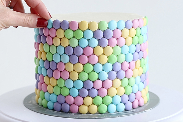 Pastel Rainbow M&M Cake | by Whitney DePaoli for TheCakeBlog.com