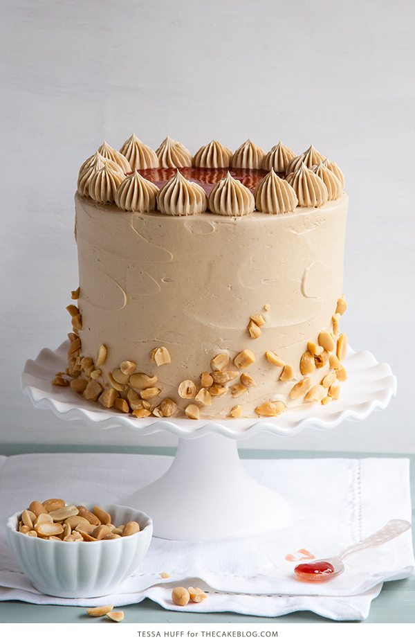 Peanut Butter & Jelly Cake | peanut butter cake with brown sugar peanut butter frosting, strawberry jam and chopped peanuts | by Tessa Huff for TheCakeBlog.com
