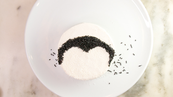 Penguin Cake - a sprinkle coated penguin cake too adorable for words | by Erin Gardner for TheCakeBlog.com