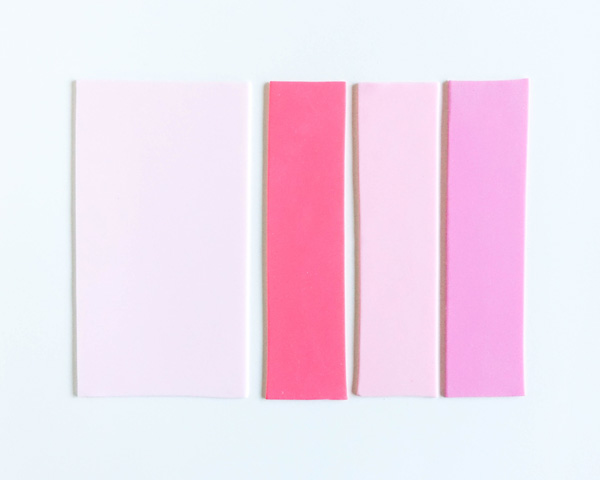 How to make striped heart toppers for cake and cupcakes | Tutorial by AK Cake Design for TheCakeBlog.com