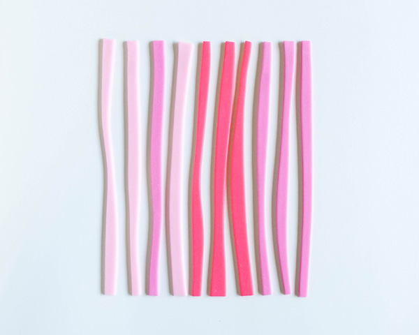 How to make striped heart toppers for cake and cupcakes | Tutorial by AK Cake Design for TheCakeBlog.com