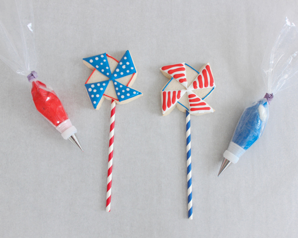 Pinwheel Cookies -- red, white and blue pinwheel cookies on a stick | by ellenJAY for TheCakeBlog.com