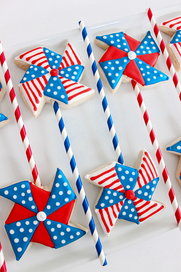 Pinwheel Cookies -- red, white and blue pinwheel cookies on a stick | by ellenJAY for TheCakeBlog.com