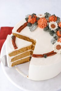 Pumpkin Spice Cake - moist pumpkin cake with cinnamon, ginger and nutmeg paired with pumpkin spice buttercream frosting | by Carrie Sellman for TheCakeBlog.com