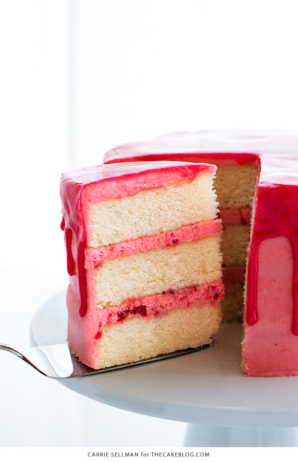 Raspberry Champagne Cake with raspberry drip glaze and fresh raspberries | by Carrie Sellman for TheCakeBlog.com