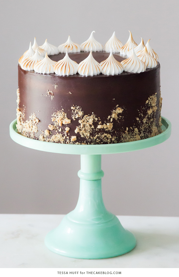S'mores Cake - s'more inspired layer cake recipe with chocolate cake, graham cracker buttercream, chocolate ganache and toasted marshmallow meringue | by Tessa Huff for TheCakeBlog.com
